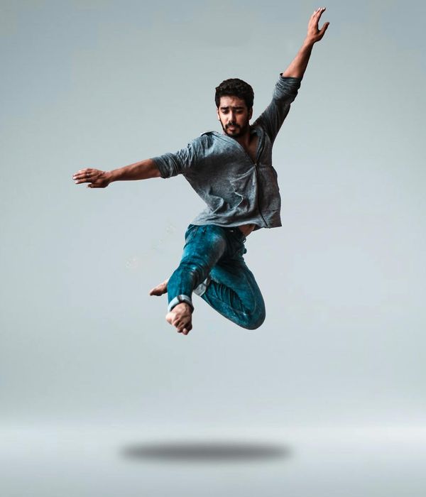 Person in a dynamic pose that expresses strength and flexibility.